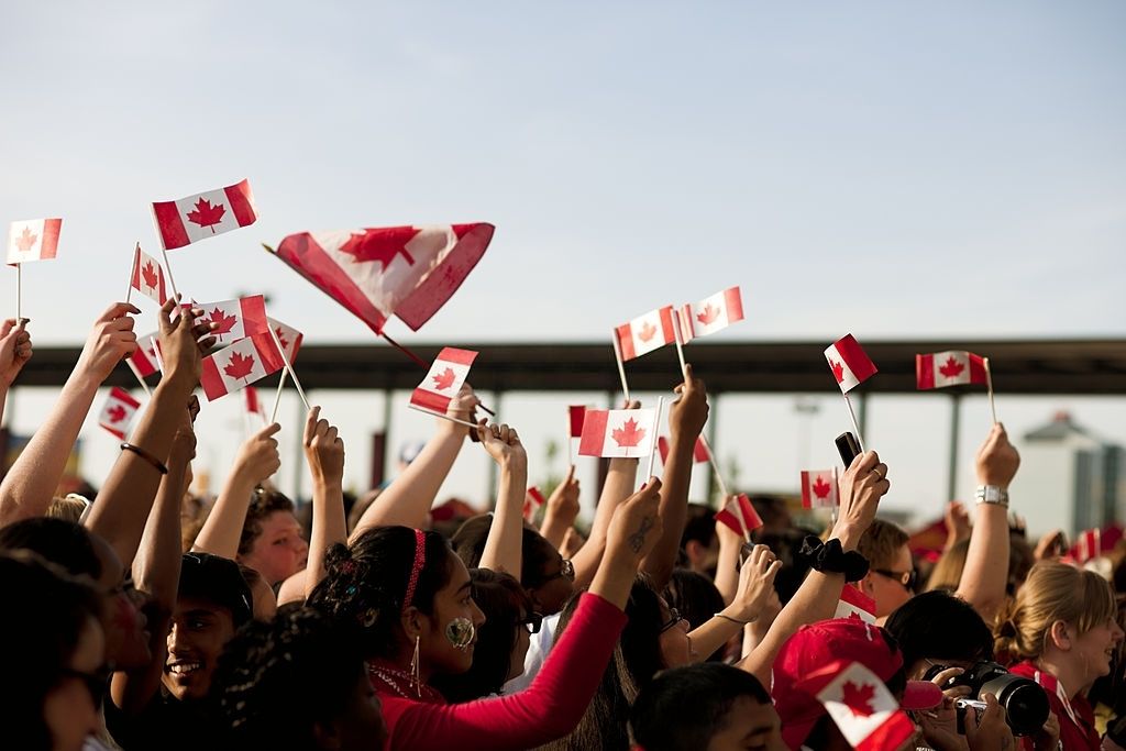 Canadians Waving Flags